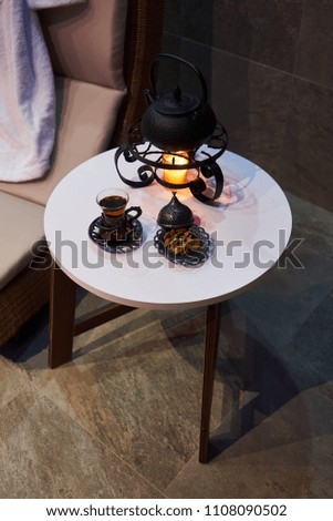 Herbal tea on table in spa salon interior, Tea ceremony concept