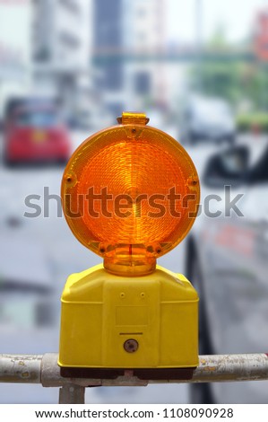 Construction site lock with signal lamp on a road