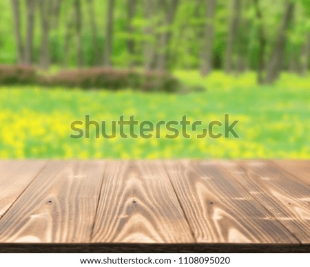 Empty wood table outside in beautiful summer day. Rustic wooden desk outdoor background. Template mock up with countertop for product advertising