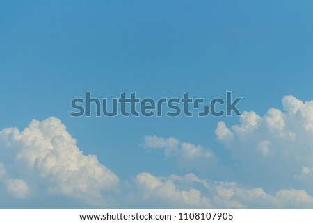 Colorful fluffy cloudscape in blue sky