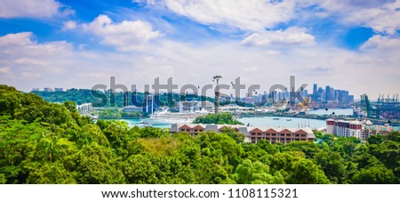 Panoramic landscape of Singapore port and cable cars. Cruise ship in the background. Viewpoint of Sentosa Island.