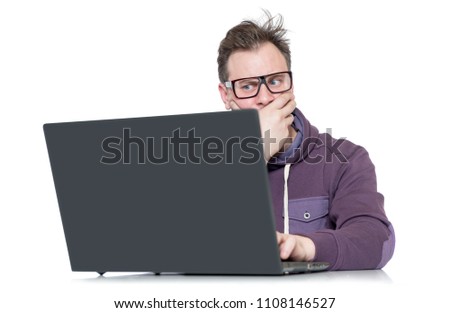 Male programmer in glasses with laptop, isolated on white background

