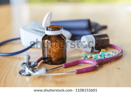 Colorful pills and medicines in the hand.
medical equipment.
Doctor Stress.