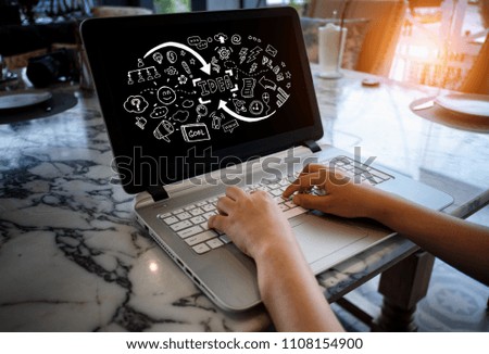 The businessman is professional working with laptop on the table and idea hand writing graphic overlay on the screen of laptop. 