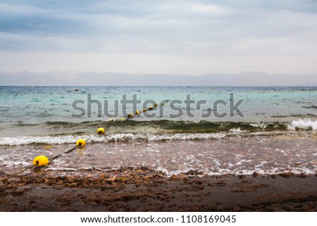 Panoramic view of sea and waves in cloudy day