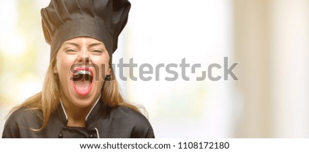 Young cook woman stressful, terrified in panic, shouting exasperated and frustrated. Unpleasant gesture. Annoying work drives me crazy