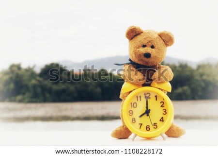 teddy bear with retro clock 
