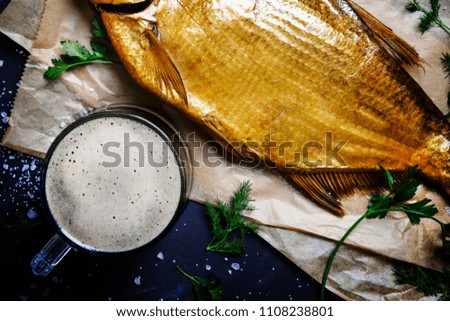 Frothy beer with smoked bream, top view