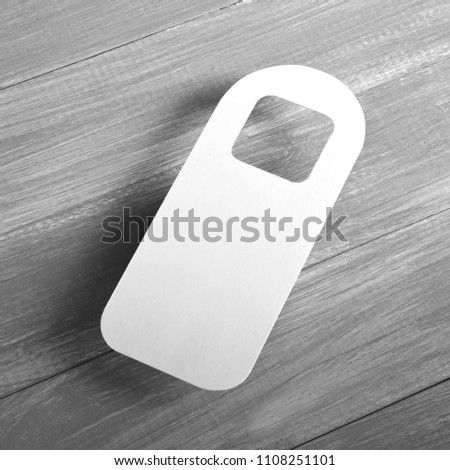 White door hanger on a wooden background