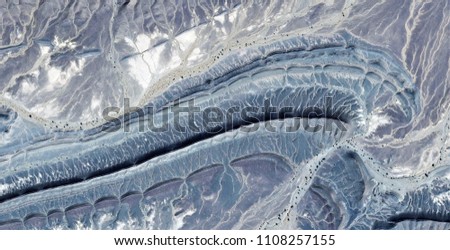 fossil of alien, abstract photography of the deserts of Africa from the air. aerial view of desert landscapes, Genre: Abstract Naturalism, from the abstract to the figurative, contemporary photo art