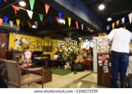 Inside coffee shop blur background with one guy.