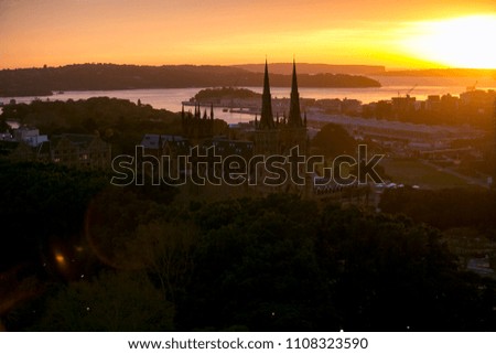 Beautiful aerial photo sunrise landscape of Sydney harbour in winter with St Mary's Cathedral on the foreground Sydney city, Australia 