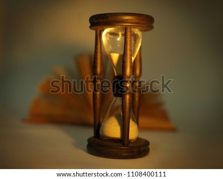 Sand glass clock with book