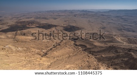 The bottom of Ramon Crater (Makhtesh Ramon), the largest in the world, as seen from the  high northern rim, Ramon Nature reserve, Mitzpe Ramon, Negev desert, Beersheba, Israel 