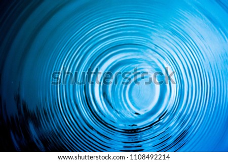 Top view Closeup blue water rings, Circle reflections in pool. Royalty-Free Stock Photo #1108492214