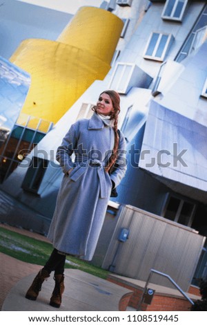 street fashion on the model on the background of an active architectural environment