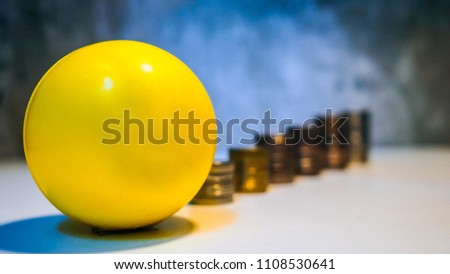  yellow ball deposit money  keeps both coins and  Coin growth on ground with money stack step up growing growth saving money, Concept financial business investment, Copy space for your text