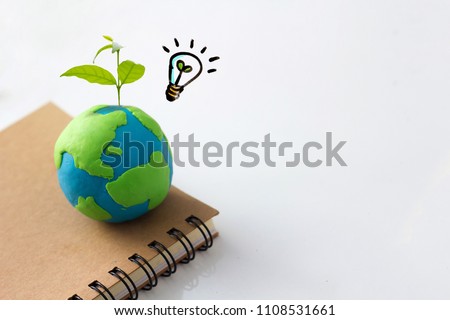 Environment conservation idea concept , earth and light bulb with plant Royalty-Free Stock Photo #1108531661