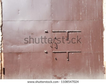 Big old brown metal warehouse or industrial door