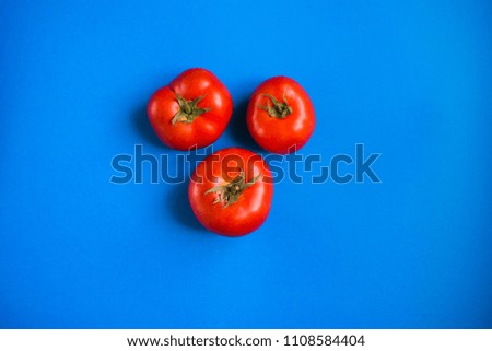 Tomatoes on a blue background