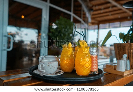 waiter with fruit cocktail