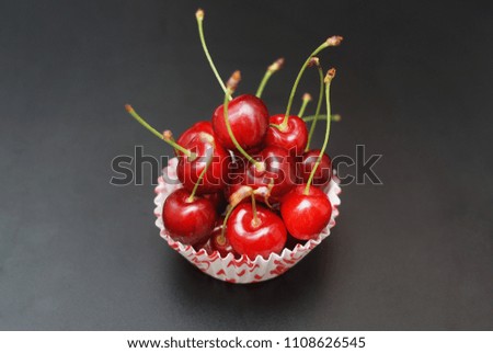 Fresh Cherry Fruit Health Vitamine in Cooking Bakery Cupcake Paper. Black Background