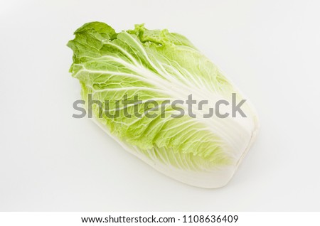 Napa cabbage or Chinese cabbage half, isolated white background