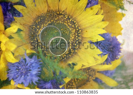 vintage pictures of rings on a sunflower bouquet