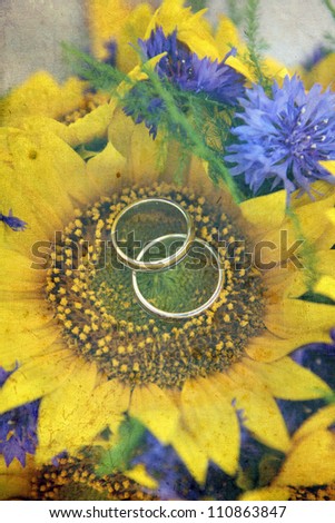 vintage pictures of rings on a sunflower bouquet