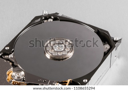 Open computer hard disk drive (HDD) closeup.