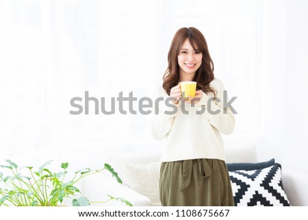 young attractive asian woman who drink coffee