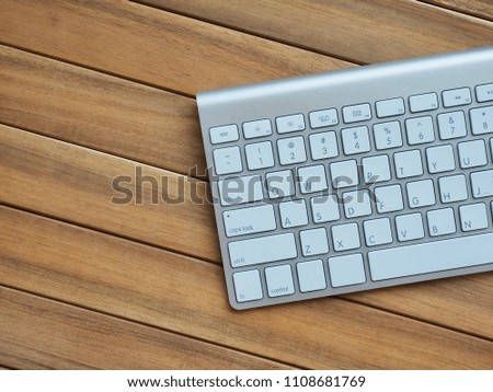 Wooden board with white keyboard
