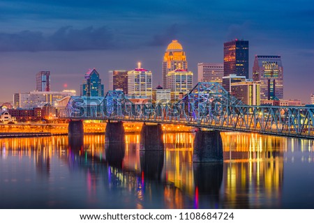 Louisville, Kentucky, USA downtown skyline on the Ohio River at dusk. Royalty-Free Stock Photo #1108684724