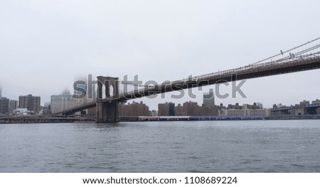 Brooklyn Bridge and Manhattan in raining day, New York City, USA
