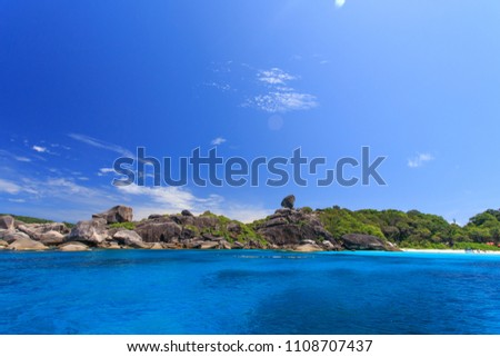 Beautiful scenery in Thailand, Amazing view of the sea, with clear water, and blue sky, Similan Island, is the tropical island of Thailand, on a summer day, in high season. Holiday background design.