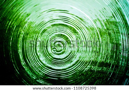 Top view Closeup green water rings, Circle reflections in pool. Royalty-Free Stock Photo #1108725398