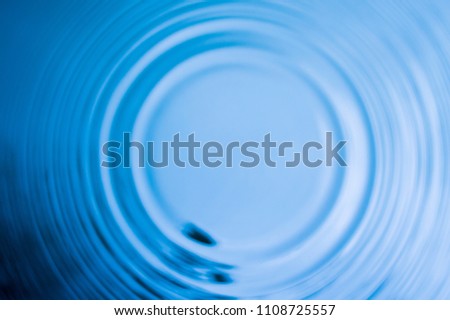 Top view Closeup blue water rings, Circle reflections in pool. Royalty-Free Stock Photo #1108725557