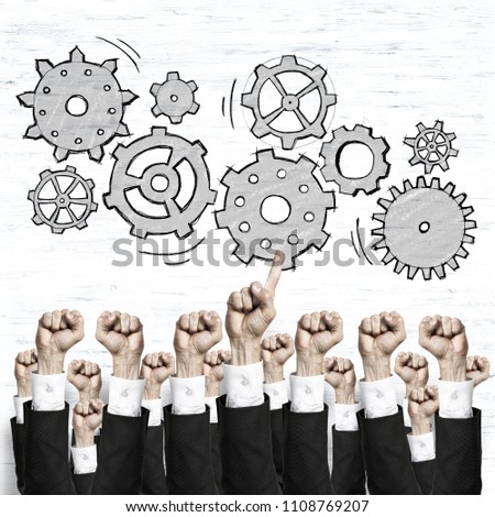 Group of hands of businesspeople showing gestures on wooden background