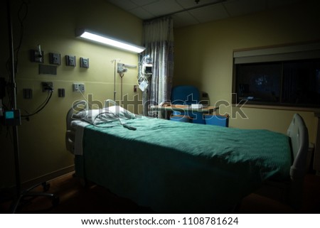 A dark, empty hospital room Royalty-Free Stock Photo #1108781624