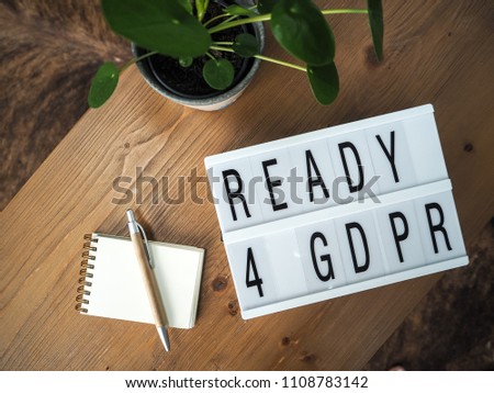 Ready for GDPR lightbox on a wooden table with accessories