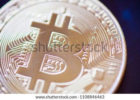 Bitcoin currency coin extreme closeup macro. Gold metal symbol