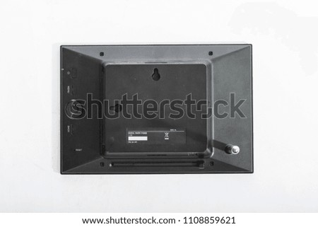 Old black electronic photo frame isolated