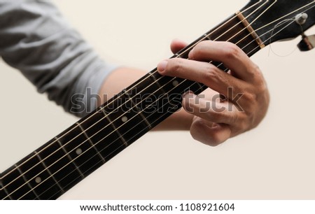 The musicians are catching the guitar chords is G chord full bar on white background,Guitar chords,Selective focus