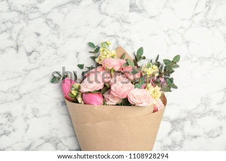 Bouquet of beautiful fragrant flowers on marble background