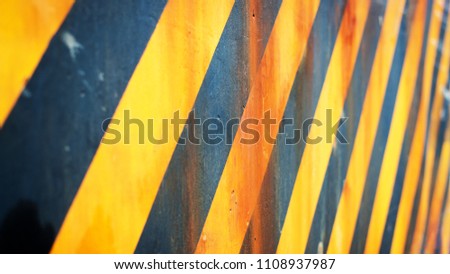 Warning hazard grunge rusty pattern in yellow and black color