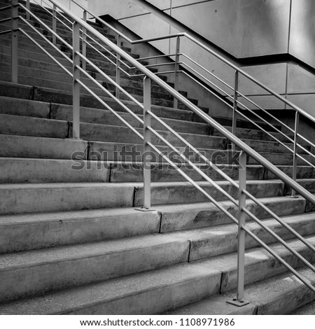 Concrete stairs in modern urban architecture, black and white photography.