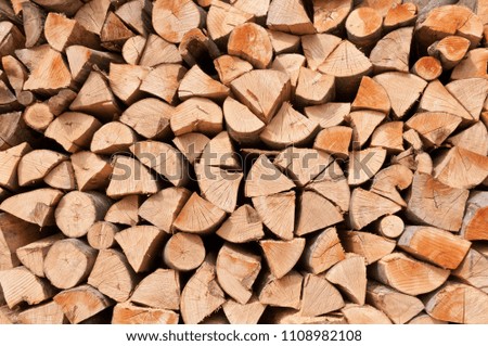 Background of dry chopped logs.