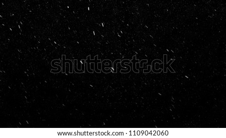 Falling down real snowflakes from left to right, fast snow, shot on black background, matte, wide angle, isolated, perfect for digital composition, post-production