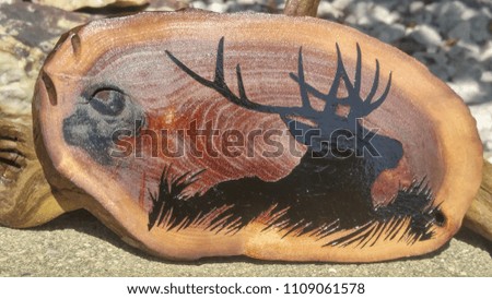 A Picture Of An Elk Stenciled On Wood Creates A Beautiful Plaque