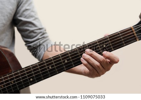 Guitar chords,Selective focus,Guitarist,The musicians are catching the guitar chords is C chord full fingers touch on bar with white background